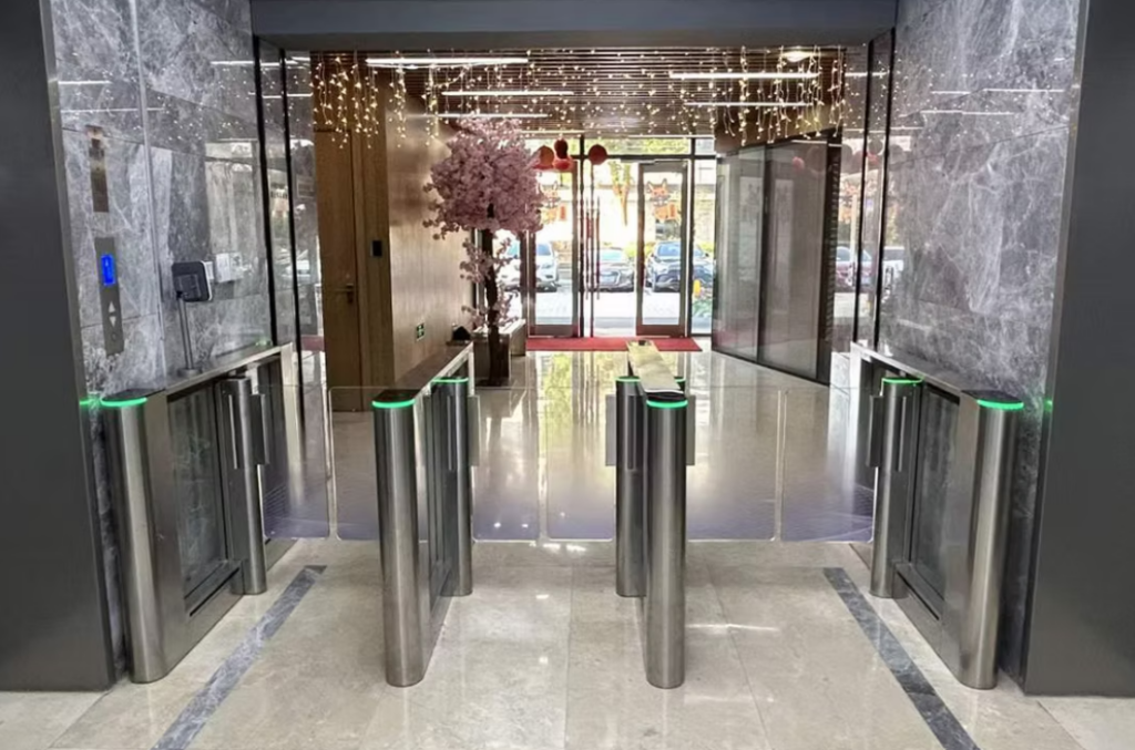 EVOLVE PG127 access-controlled pedestrian gate installed at a compact staff entrance for regulated entry and exit